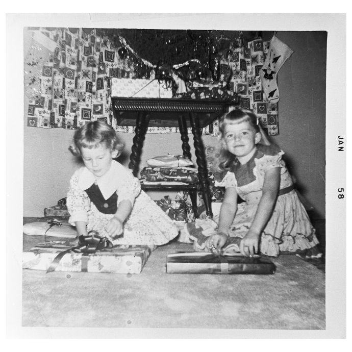 A young Alice and me unwrapping gifts together Christmas morning, Eastern Oklahoma, 1958
