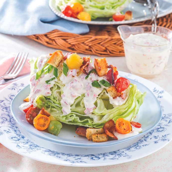Wedge Salad with cherry tomatoes on a blue-and-white dish