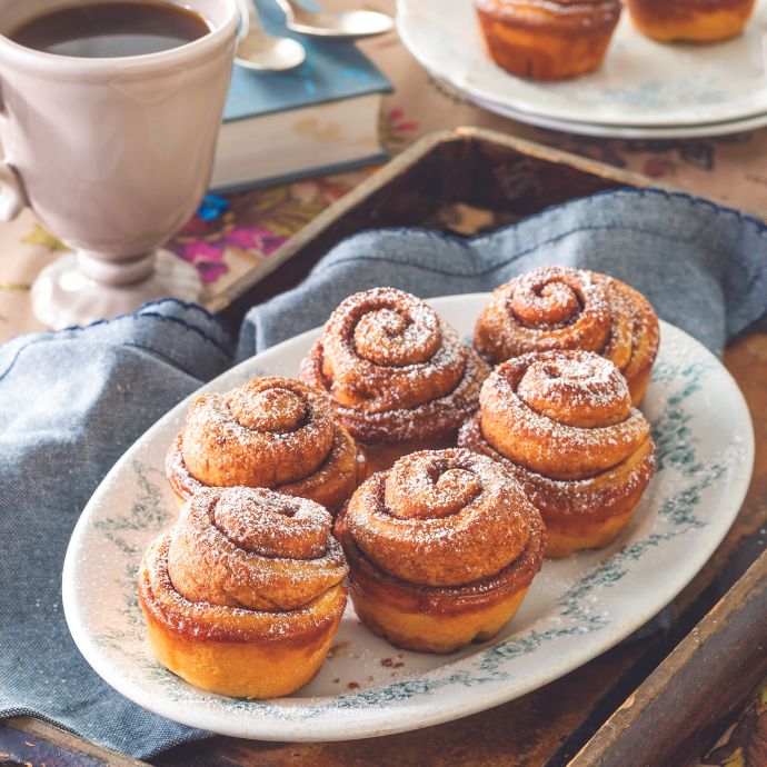 Banana-Cinnamon Swirl Rolls on a floral-rimmed plate