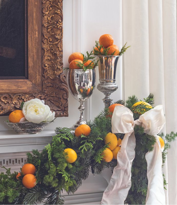 Mantel decorated with a citrus-laden garland