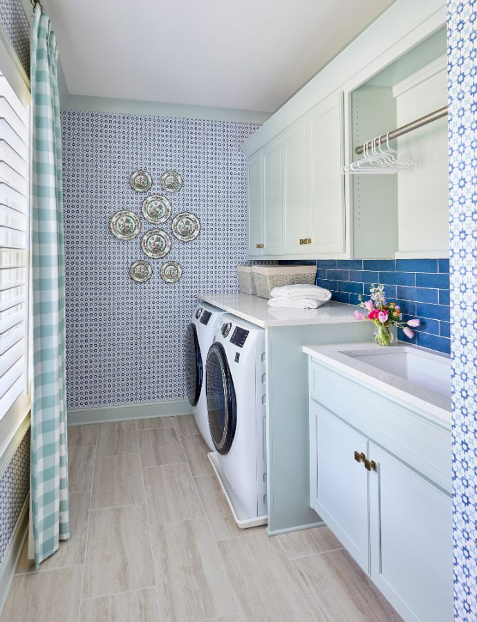 Laundry room decorated in blue, green, and white