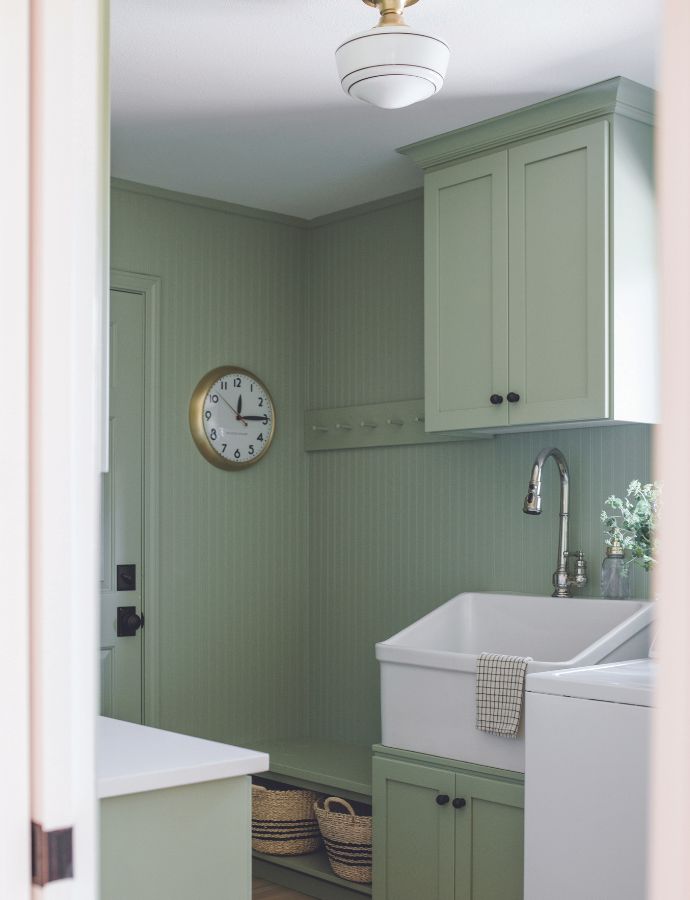 Green-and-white laundry room