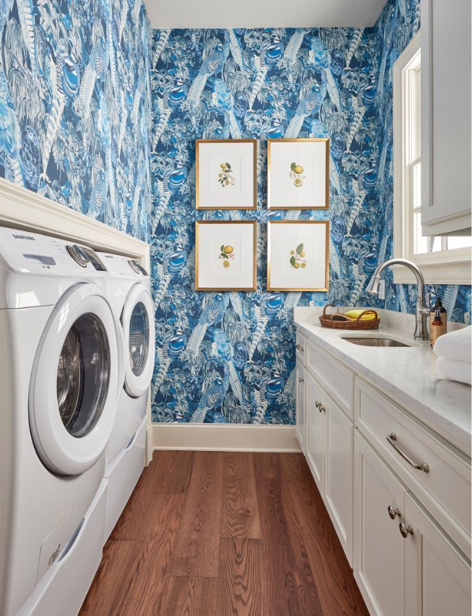 Laundry room with blue pattern wallpaper