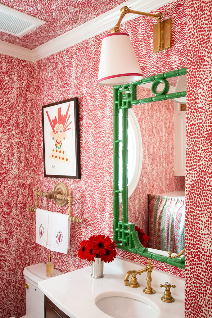 Pink-and-green powder bath with laundry space