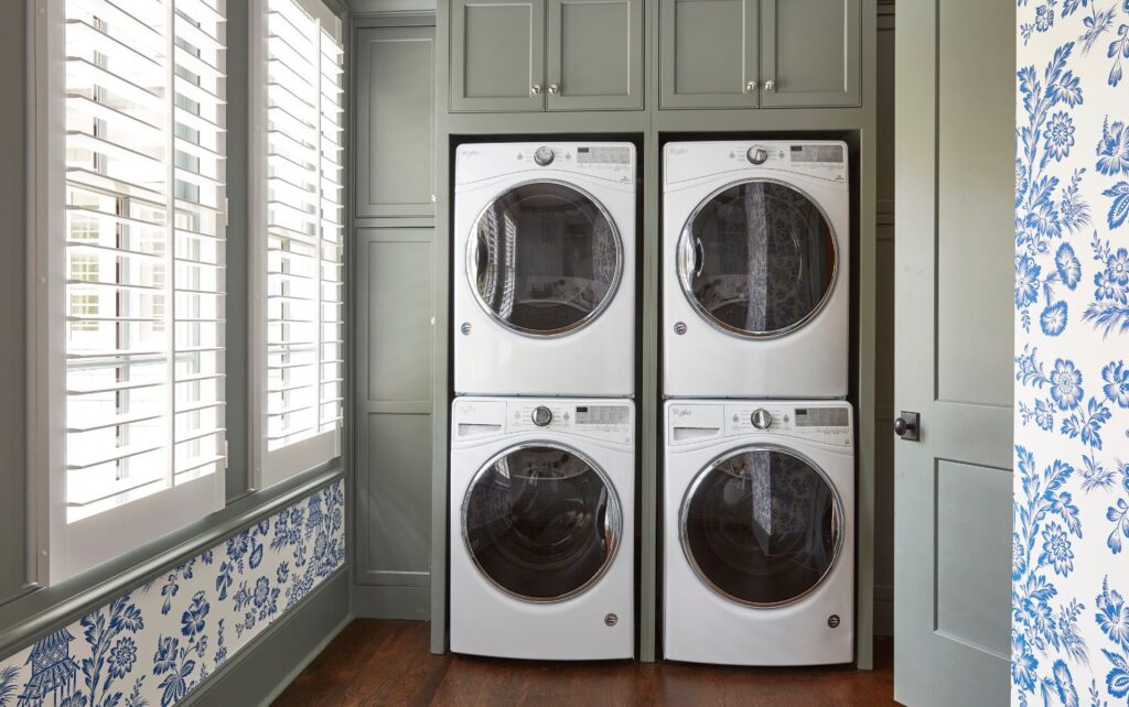 Double stacked laundry machines