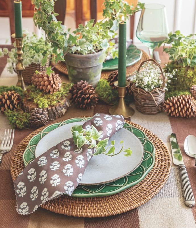 Green-and-white place setting with ivy napkin ring