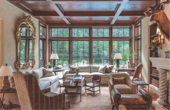 Neutral living with dark coffered ceiling and sweeping windows