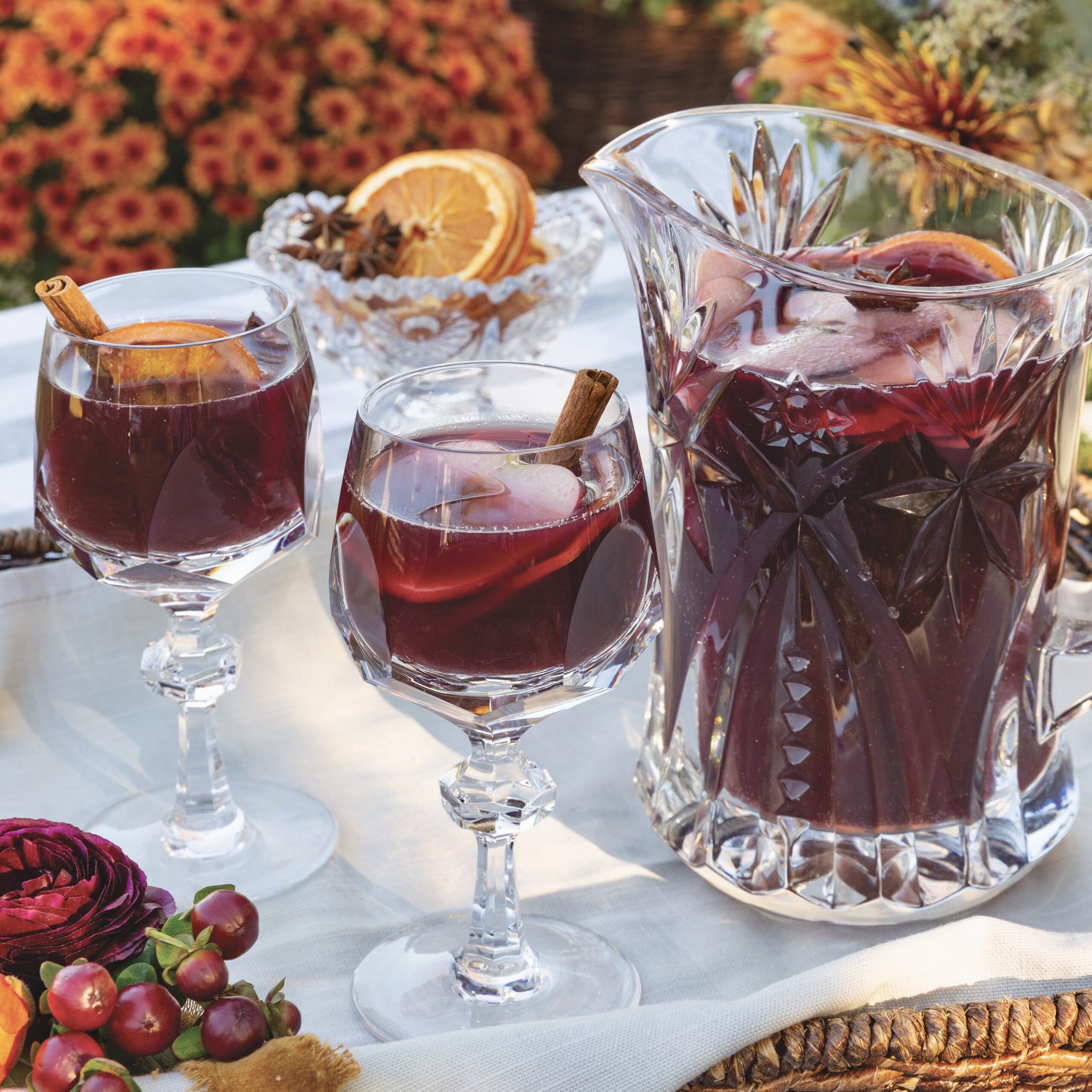 Sangria in a pitcher and 2 wineglasses