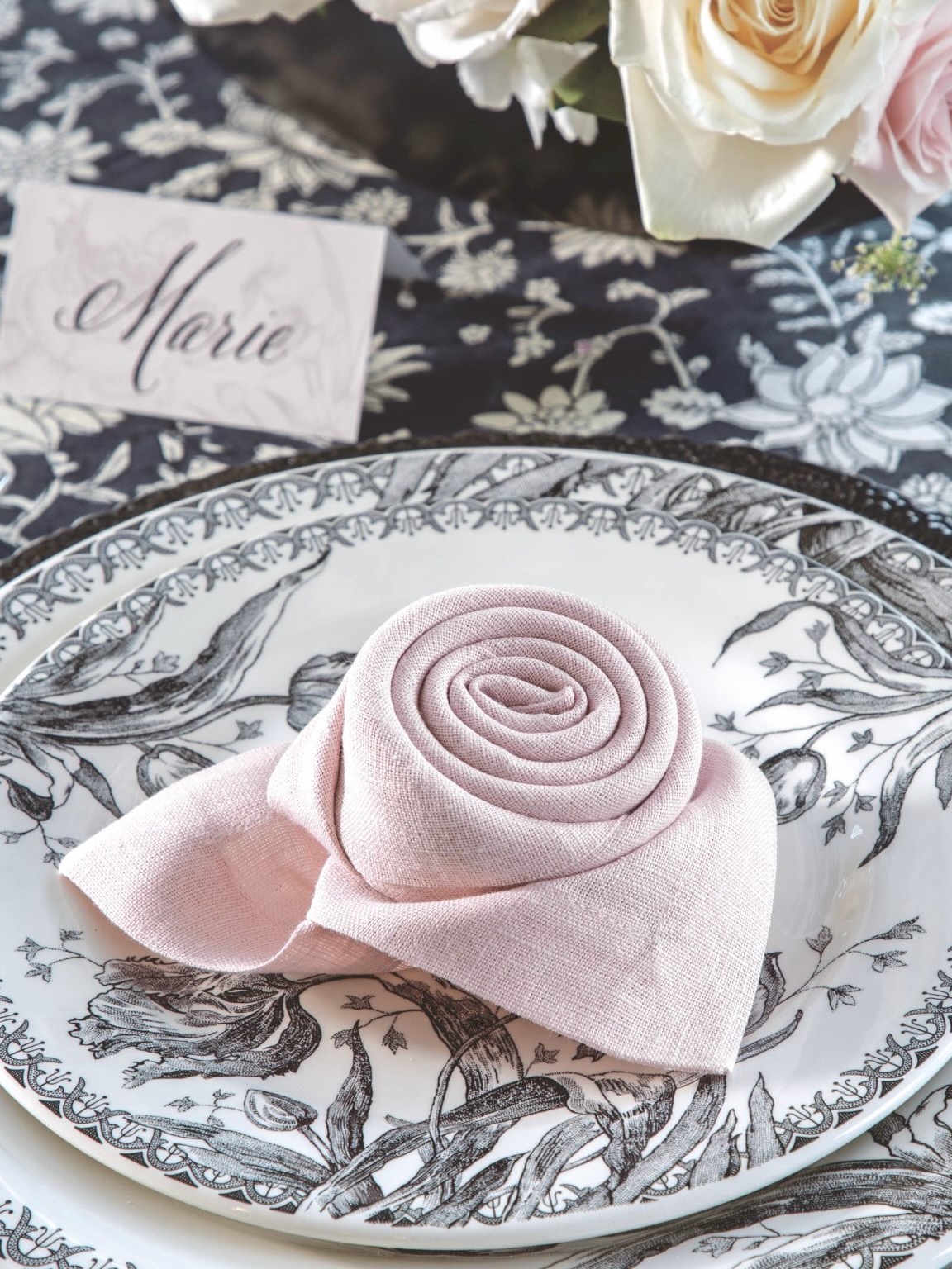 A napkin folded into a rose shape.
