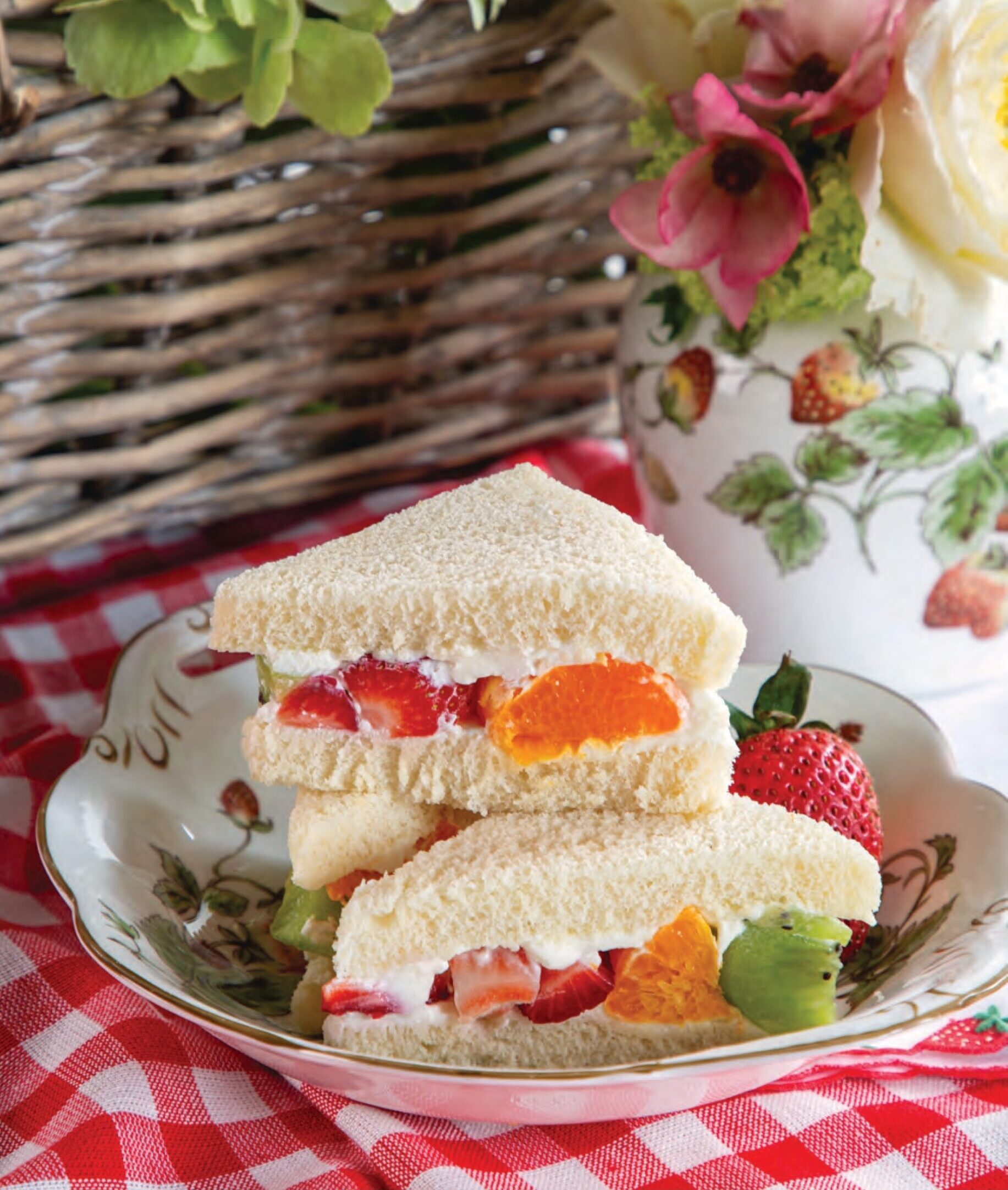 Strawberry, Kiwifruit, and Clementine Finger Sandwiches on a plate.