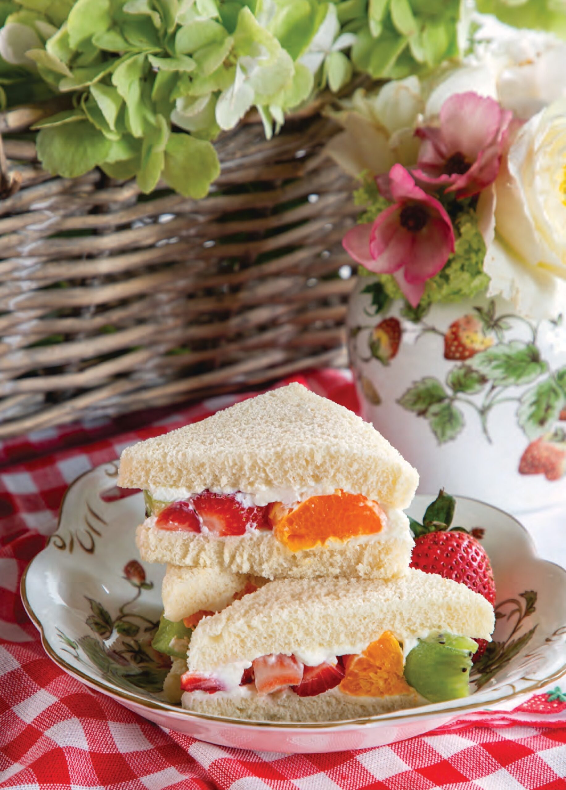 Strawberry, Kiwifruit, and Clementine Finger Sandwiches on a plate.