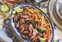 Sizzling Steak Fajitas A platter of steak fajitas with colorful bell peppers