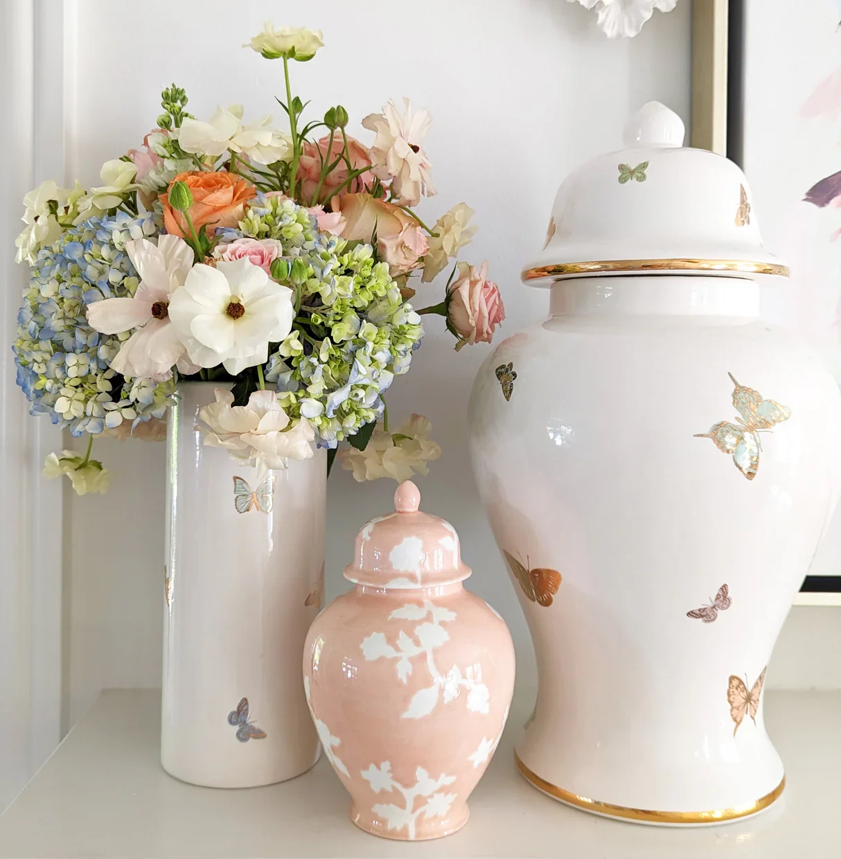 butterfly-accented vases and ginger jars from the collaboration between Ruby Clay and Lo Home