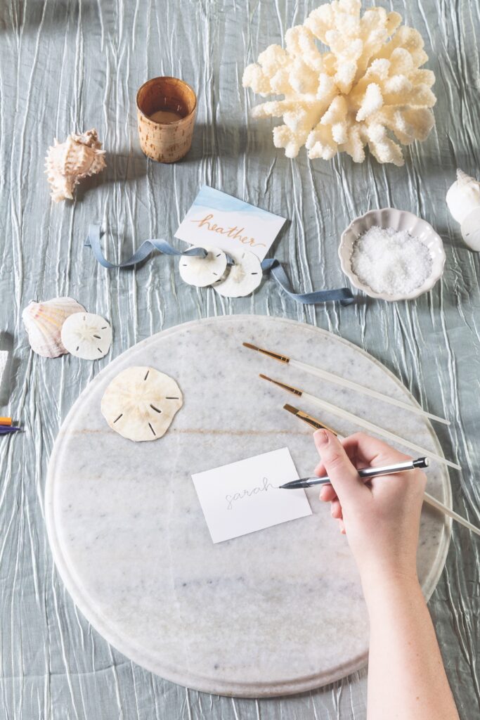 Hand holding water color paint brushes