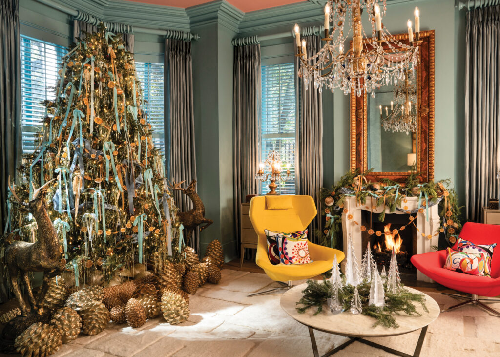 Living room with Christmas tree and greenery decor