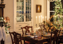 Enjoy the Comforts of Home in Our November/December 2025 Issue Table set for a Christmas dinner with lit Christmas tree in the background