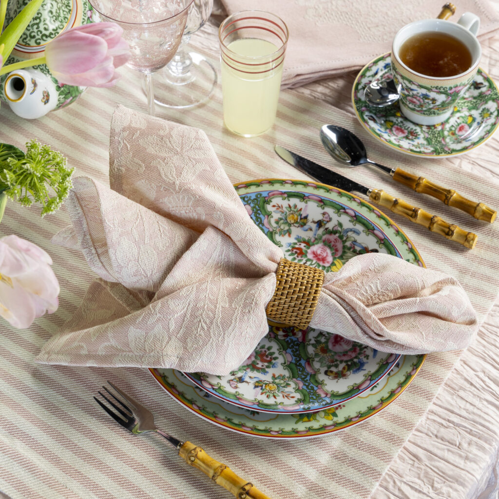 Place setting with pink napkin