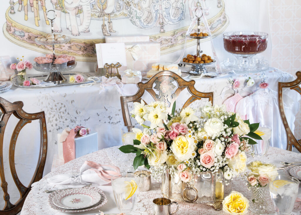 Table setting for baby shower with bright florals