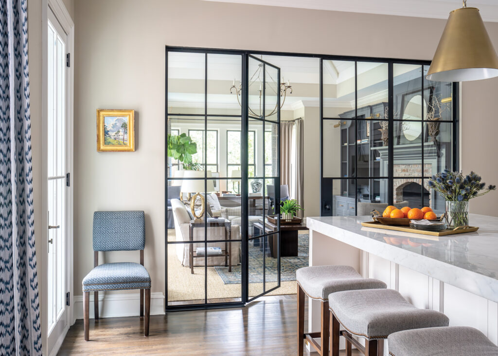 Kitchen bar area with glass panel door leading into living room