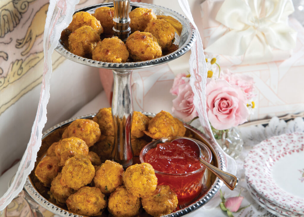 Sweet potato sausage balls on a tiered silver platter