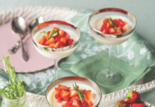 Tarragon and Strawberry Panna Cotta Three coupe glasses filled with panna cotta and topped with sliced strawberries.