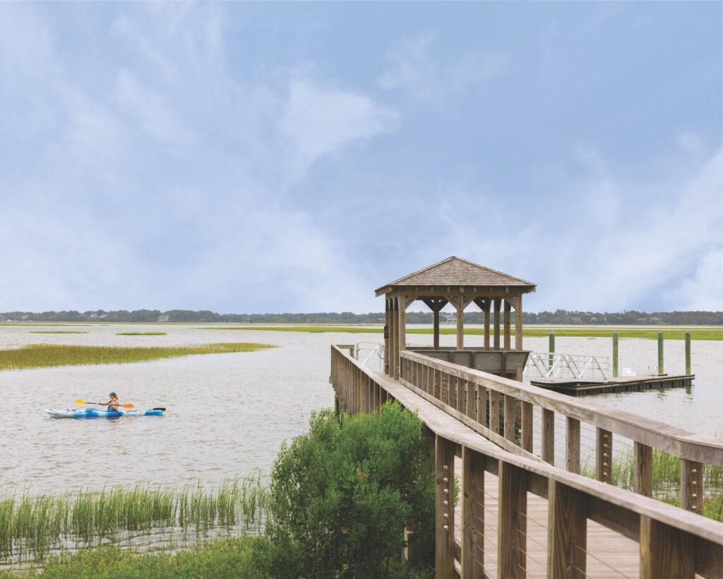 A dock leading to a lake.