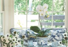 5 Breakfast Recipes for a Glorious Morning A breakfast nook set with blue and white tableware with a white orchid as a centerpiece.