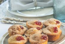 Strawberry Jelly Doughnut Muffins Strawberry Jelly Doughnut Muffins in a blue platter set at the dinner table.