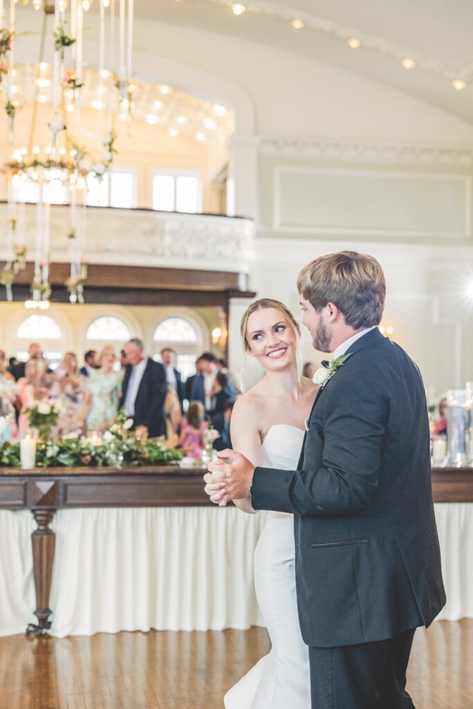 A newlywed couple dancing their first dance.