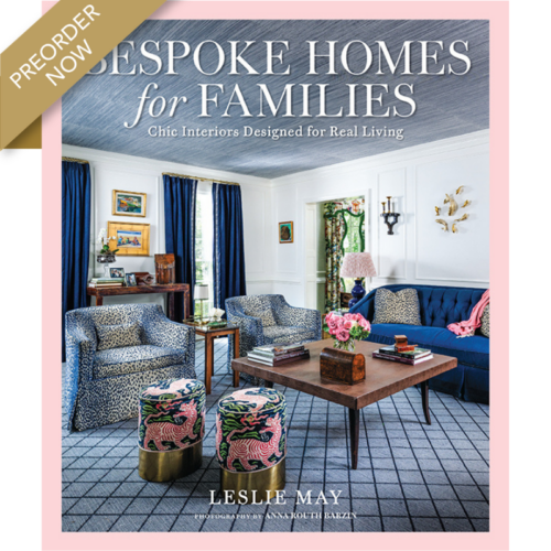 Book cover for Despoke Homes for Families, showing a chic living room with a blue sofa, patterned chairs, pink flowers, and a pink border with a preorder badge.