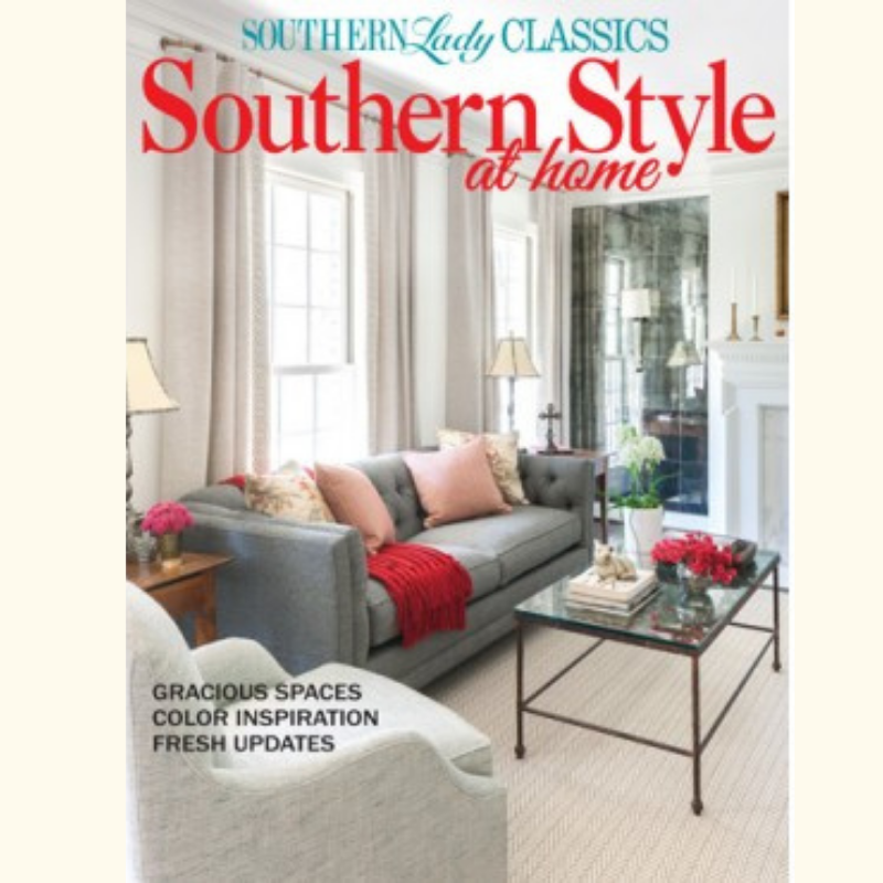 Cover of Southern Style at home magazine featuring a bright living room with a grey sofa, pink cushions, a red throw, glass coffee table, and upright lamps; cover text includes 'Gracious Spaces', 'Color Inspiration', 'Fresh Updates'