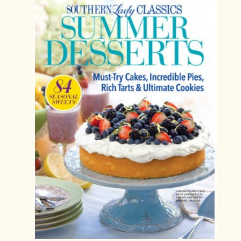 Cover of Southern Lady Classics: Summer Desserts, showing a blueberry-topped cake on a blue pedestal with lemons and a pink dessert in the background.
