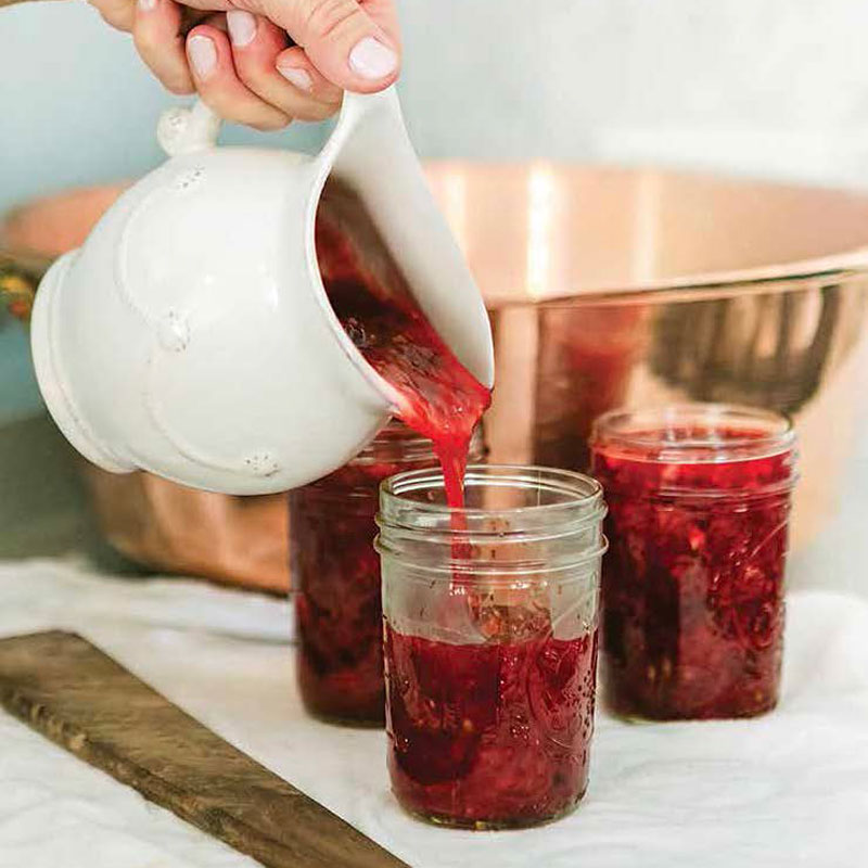 Jam being poured into jar